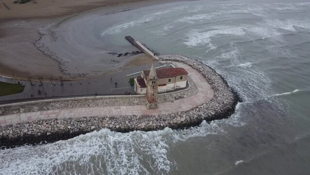 Bell tower of Caorle, aerial shot of a church in the Veneto region