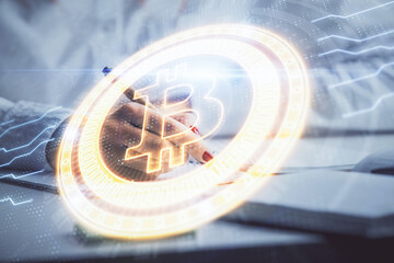 Cryptocurrency hologram over woman's hands writing background. Concept of blockchain. Double...