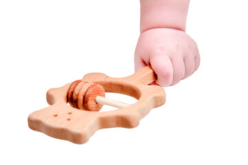 Baby hand and toy rattle abacus, close-up, isolated on a white background. Children fingers and an...