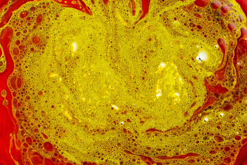 Abstract green red background. Mixed liquid red and green paints. Fluid Art backdrop