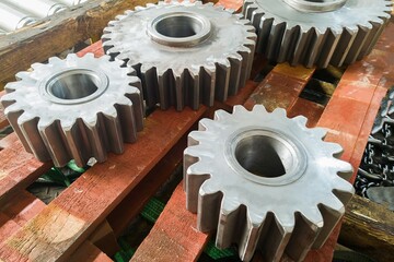 Round gears after turning and milling on the rack closeup.