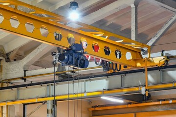 Overhead crane for lifting parts, assemblies and mechanisms at the factory.