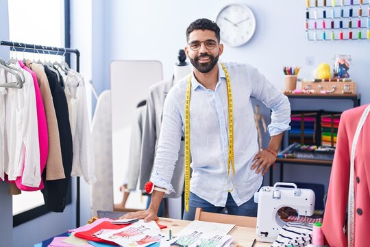 Young Arab Man Tailor Smiling Confident Standing At Tailor Shop