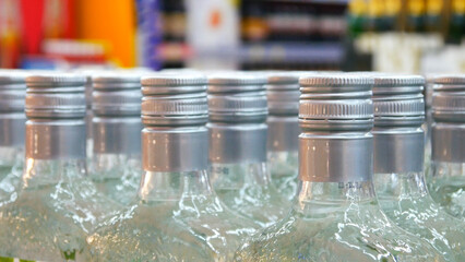 Close-up of many hard drink bootles in a store