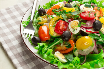 Vegetable salad , with quail eggs and olives, fresh, close-up, no people,