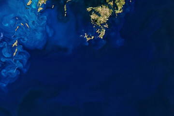 Amazing ocean with blue color waves view from above. Blue tones and nature sea with island top view