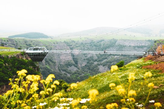 Dashbashi, Georgia - 19th june, 2022: Aerial view Diamond shape platform on glass bridge over scenic dashbashi valley in Georgia countryside. Famous modern bridge over valley