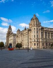 Fototapeta na wymiar Liverpool, England. The Three Graces' part of Liverpool Maritime Mercantile City. On the left is the Royal Liver Building, in the centre is the Cunard Building