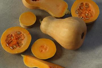 cut fresh pumpkin on the grey background