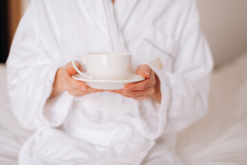 woman holding cup of coffee