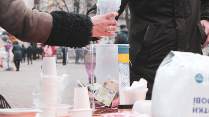 Glass box for donations on the street in Ukraine