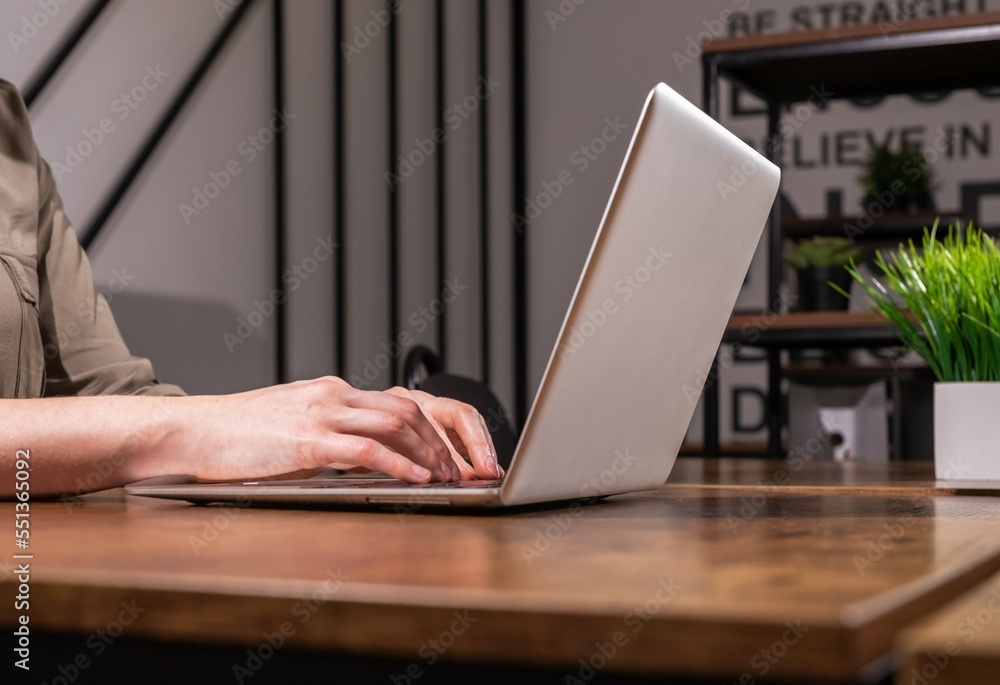 Aufkleber hands typing on laptops keyboard. person works at computer in modern office, closeup