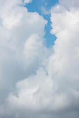 Obraz premium white cumulus clouds against a blue sky, beautiful large thunderclouds in the sky. background of nature. freedom and flight above the earth among the clouds, a dream and a desire. place for