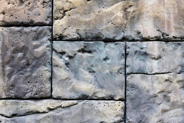 large stones in the wall, a background of old stones of a rectangular shape