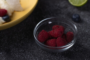 morning breakfast, juicy berries and fruits in a plate, orange, blueberry, raspberry, sea buckthorn and others