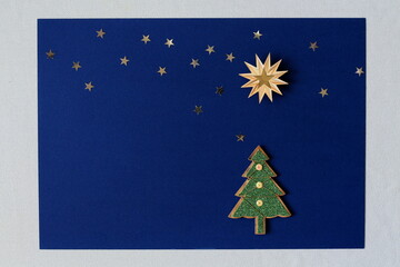 Christmas background with xmas tree and stars, Merry christmas card with blank space for text / wishes,  winter holiday theme, Happy New Year. 