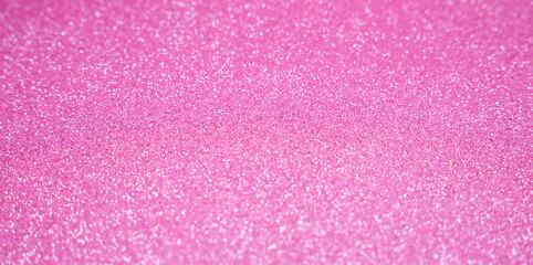 Glitter pink background in blur. Abstract shiny background. Banner. Selective focus.