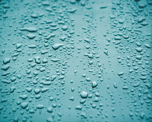 Raindrops on the hood of a car