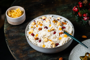 Traditional Christmas kutia. Boiled rice porridge. traditional Slavic holiday ritual dish. Sweet pilaf with nuts. Kutya Ukrainian. Orthodox christmas