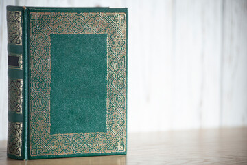 antique green coloured book with space copy.