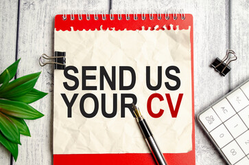 red notebook, send us your cv words and white background