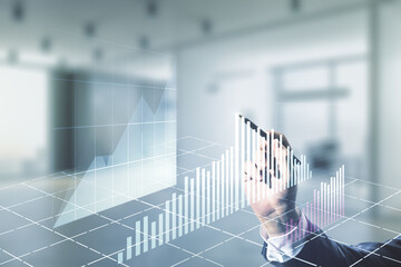Man hand with pen working with abstract virtual financial graph on blurred office background, forex and investment concept. Multiexposure