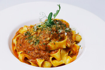 italian pasta with minced beef ragu known as bolognese sauce in serving plate