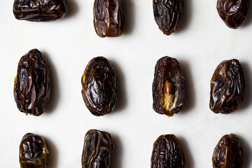 Dates fruit pattern on white background. Dried organic Superfood.