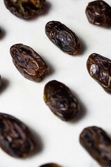 Dates fruit pattern on white background. Dried organic Superfood.