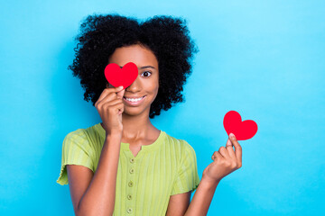 Closeup photo of little positive excited smiling young lady teenager cover eye red paper heart good...