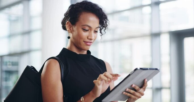 Tablet, business woman and walking in office, checking email or research. Tech, female and employee from Brazil in company workplace with digital touchscreen for social media or internet browsing.