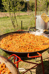 Vegan Paella, typical Spanish rice dish in its vegan version. Preparation of the vegan paella