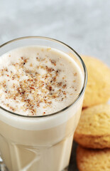 coffee with milk and grated nut in a glass close-up. Raff coffee