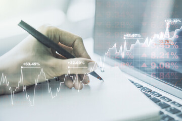 Abstract creative financial graph with hand writing in diary on background, financial and trading concept. Multiexposure