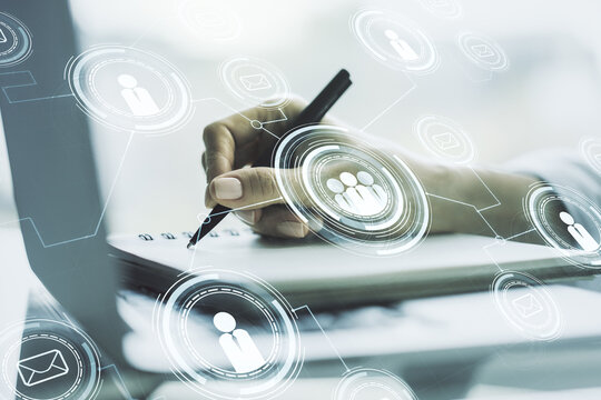 Social network media concept with hand writing in diary on background with laptop. Double exposure