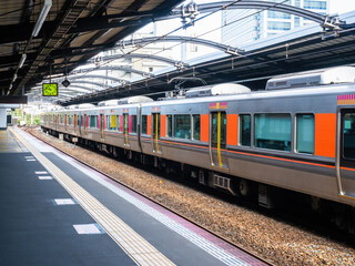 Railways of Japan. Train to Tokyo. Railroad station. Train travel in Japan. Empty train station in Tokyo. Tourism to Japan. Railway station without anyone. Passenger boarding area on subway car