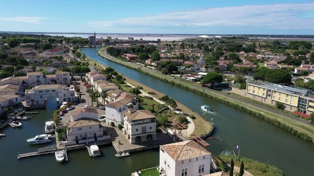 aerial view of the Canal du Rhone a Sete in Aigues-Mortes with a leisure boat 