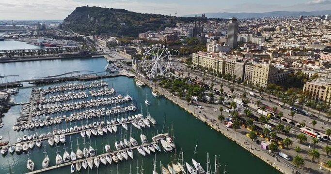 aerial stock footage at a waterfront with a port and marina on a sunny day