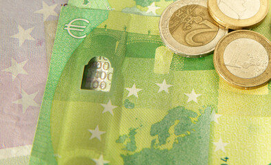 paper banknotes and coins of European currency in sunlight. banner. selective focus. High quality photo