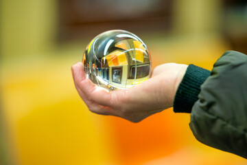 Woman hold a Crystal Ball with subway train reflection