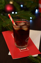 glass with brown sweet drink on the table