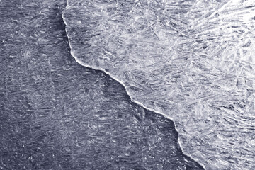 Crack on the ice surface of a frozen reservoir, river or lake,.