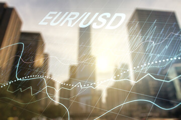 Double exposure of abstract virtual EURO USD forex chart hologram on modern skyscrapers background. Banking and investing concept