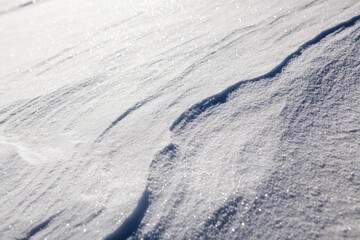 Fototapeta na wymiar Natural snow texture background, closeup top view