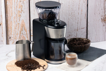 electric coffee grinder on non isolated background 