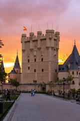 Obraz premium View of the main Tower of the Alcazar de Segovia with Spanish Flag in the Air