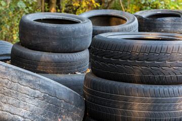 Heap of old truck and car tires with worn treads