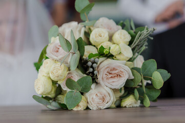 Bridal bouquet with roses on a brown background. Beautiful bridal bouquet