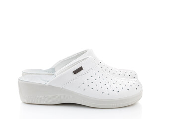 White professional ventilated work clogs. White hospital clogs. isolated on white background. Close-up.