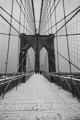 Brooklyn Bridge in New York City with snow in winter